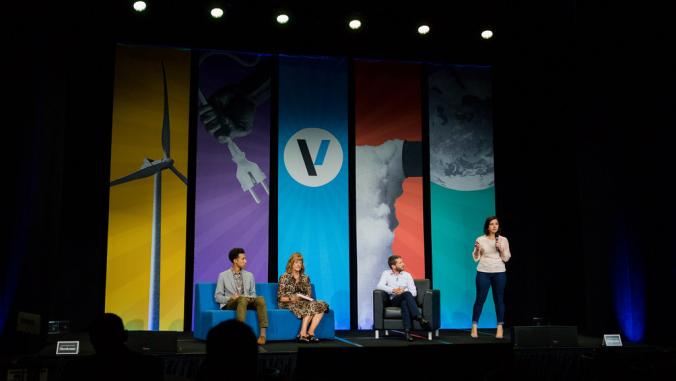 Person presents on stage during Accelerate pitch competition at VERGE 19