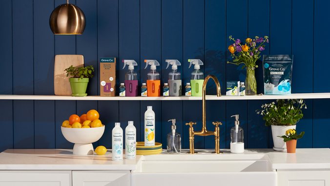 An assortment of Grove Collaborative products on shelves and countertops